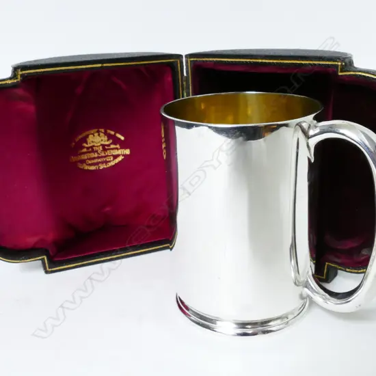 An Edwardian silver mug in leather case