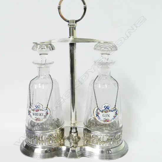 An Edwardian silver plated two-decanter tantalus set