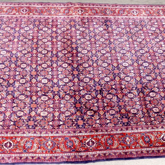 A large hand knotted Hamadan carpet