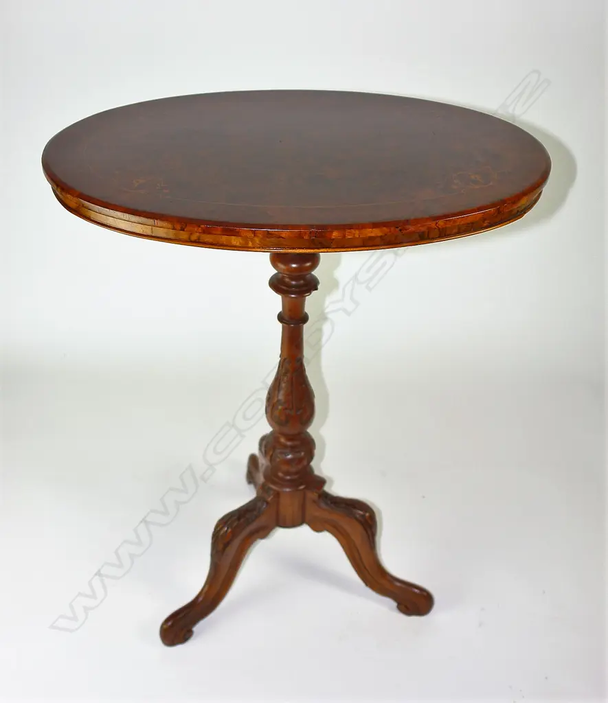 A Victorian burr walnut oval wine table Image 1++