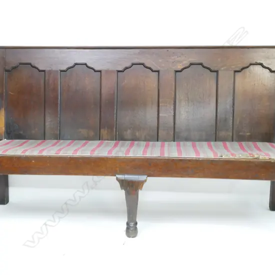 A George III oak five panelled back settle
