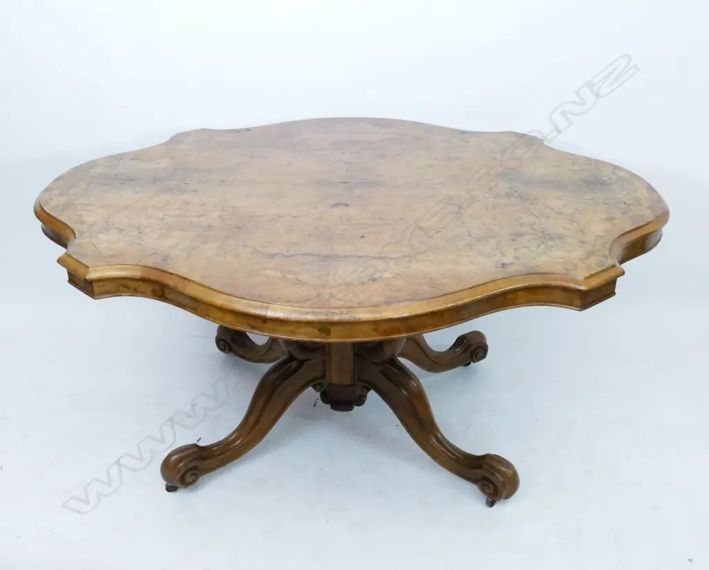 A Victorian burr walnut loo table Image 1++