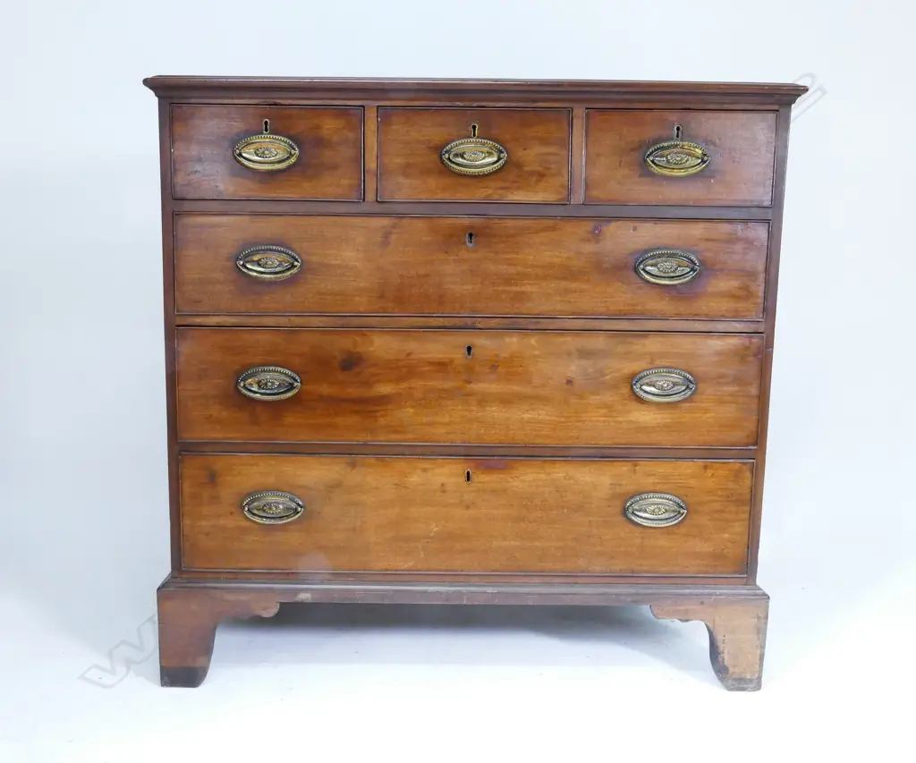 A Georgian flat-front mahogany chest of six drawers Image 1++