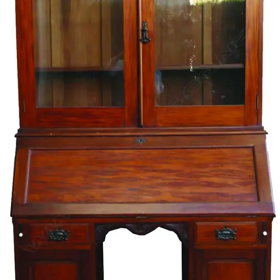 A colonial mottled kauri bookcase bureau