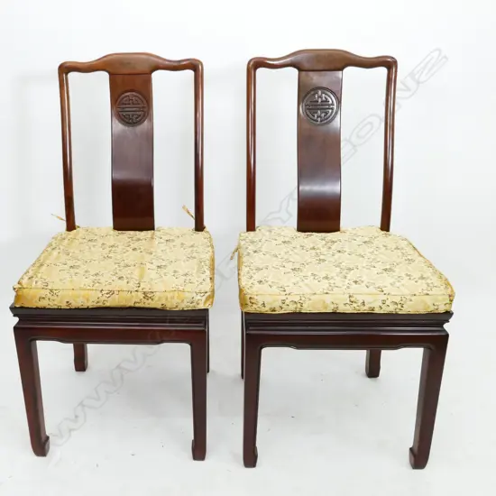 A Chinese rosewood extension banquet table and eight chairs