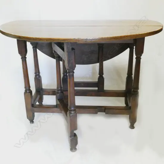 A Georgian oak gate leg table