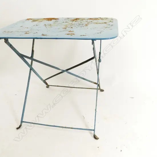 An old French blue paint finish metal cafe table with folding base