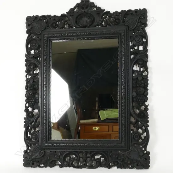 A Victorian ebonised wood mirror