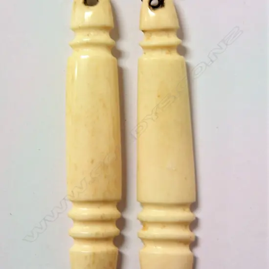 A pair of Owen Mapp carved bone earrings