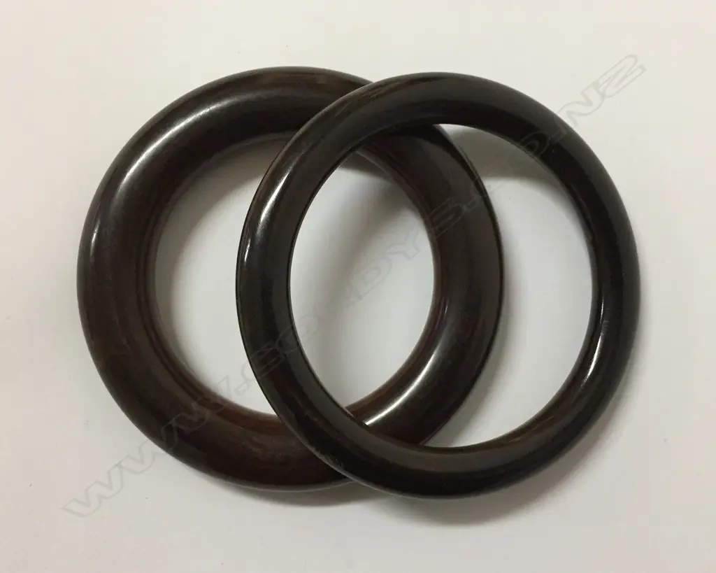 Two carved lignum vitae (from a bowling ball) bangles Image 1++