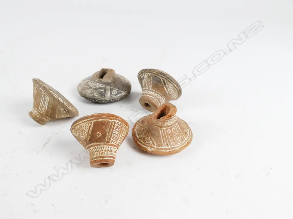 Five antique Peruvian clay weaving weights Image 1++