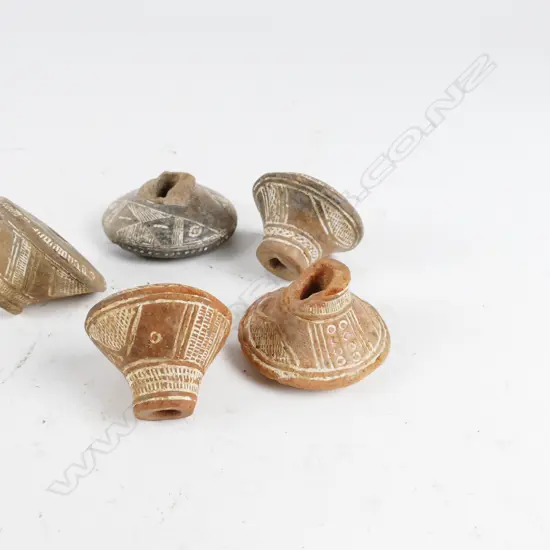 Five antique Peruvian clay weaving weights