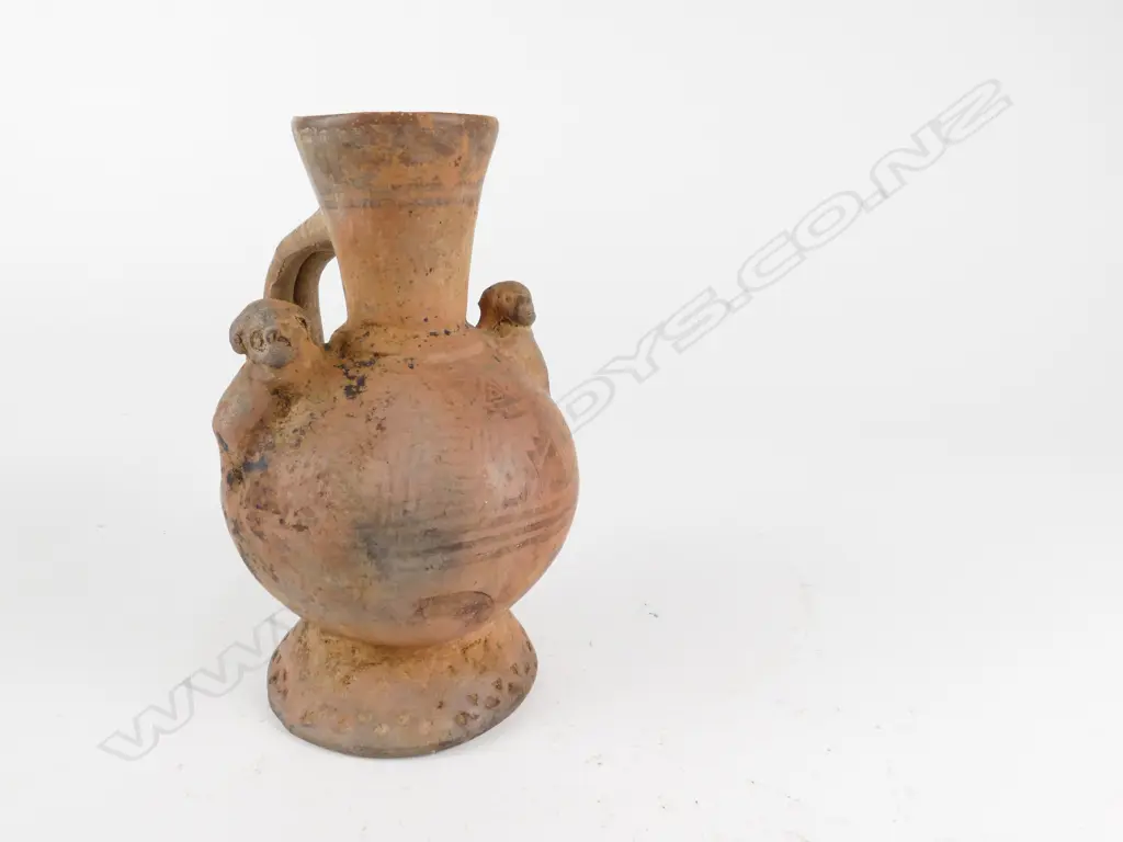 An antique pottery jug Image 1++