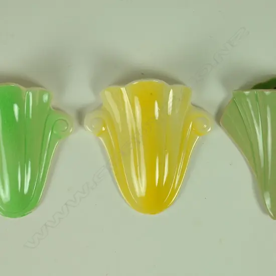 Three small Crown Lynn glazed wall pockets