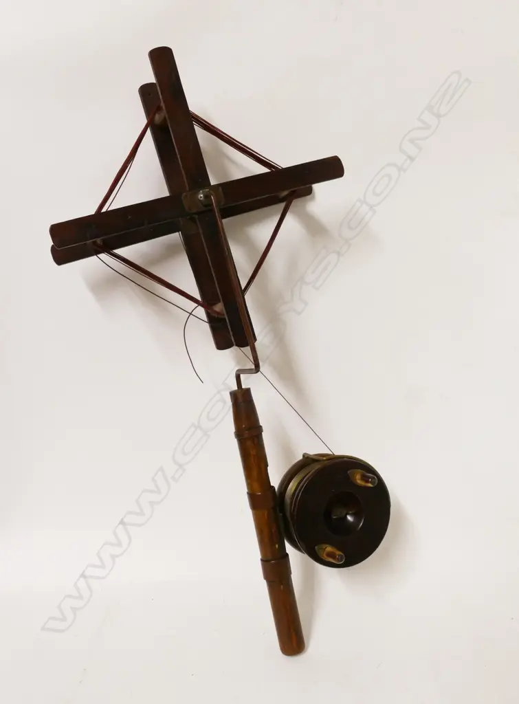 A wooden line winder with copper and brass fittings Image 1++
