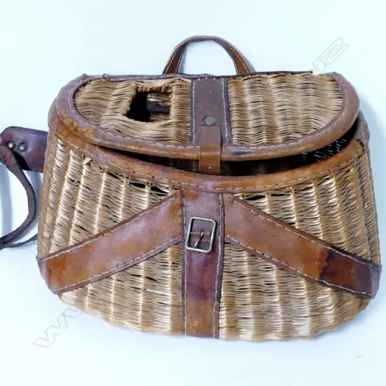 An American leather bound wicker fishing creel