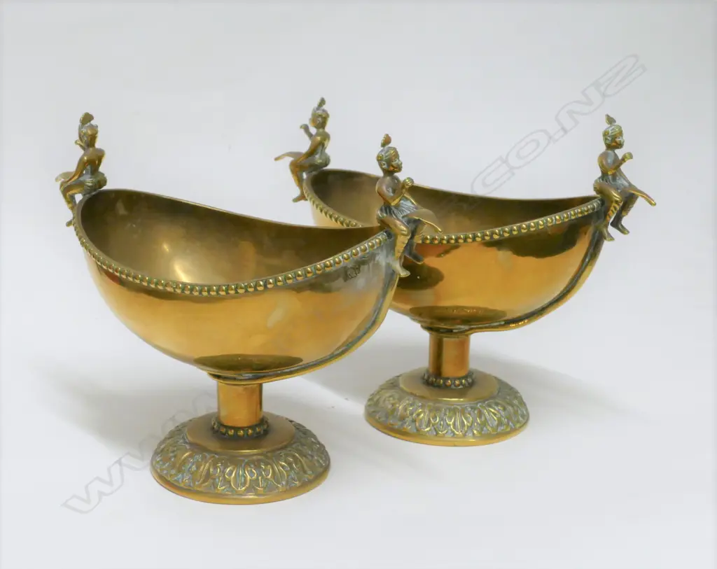 A pair of Indian brass dishes on pedestal bases Image 1++