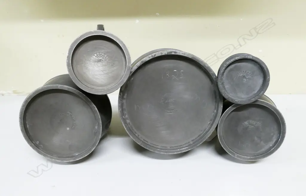A graduated set of five 19thC Irish haystack pewter measures by Joseph Austin & Son Image 1++