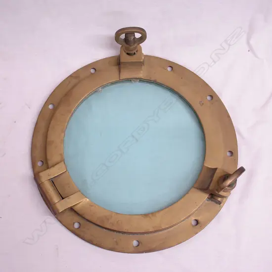 A vintage brass ship's porthole window
