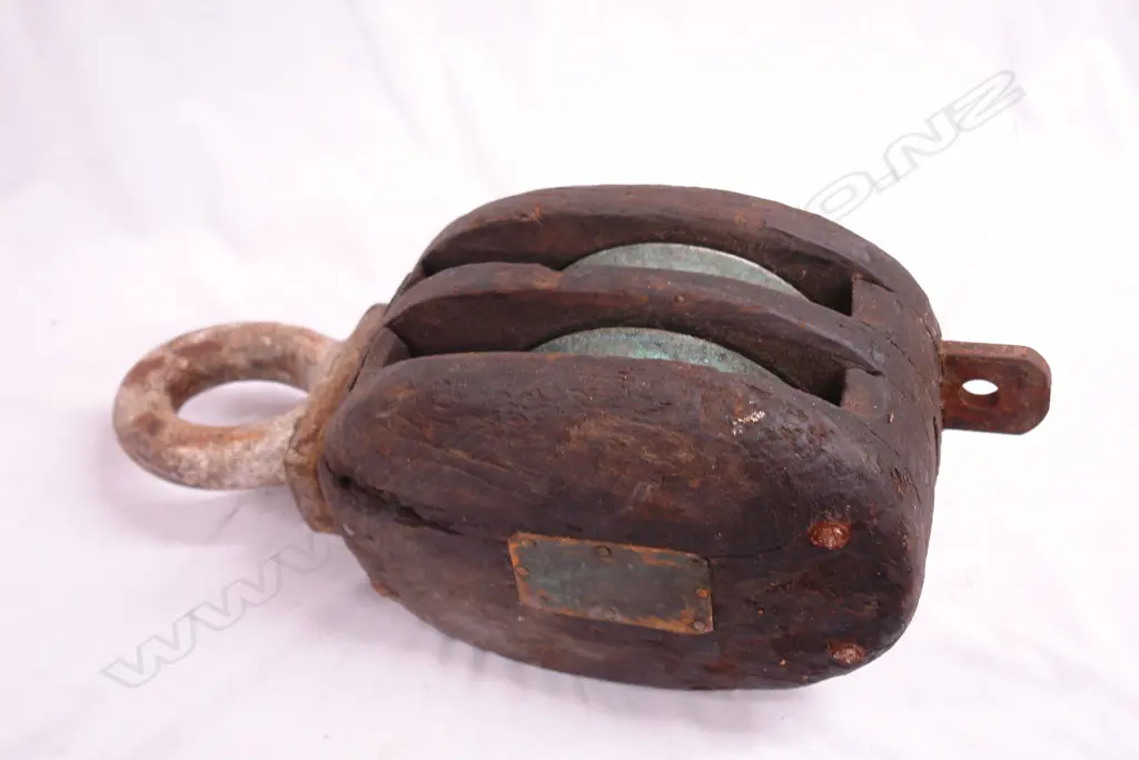 An old wooden ship's double pulley Image 1++