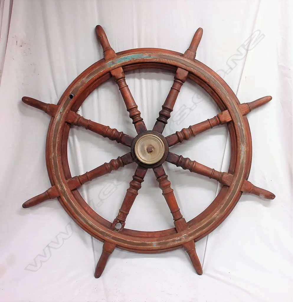 An old ship's teak eight spoke wheel from the "Rahiri" Image 1++