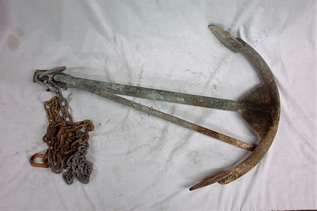 An old galvanised iron ship's Herreshoff anchor with wedge securing the top arm Image 1++