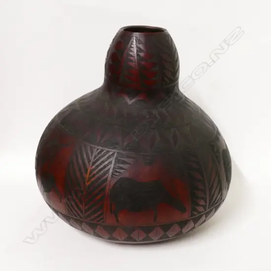 A large old Tanzanian carved gourd