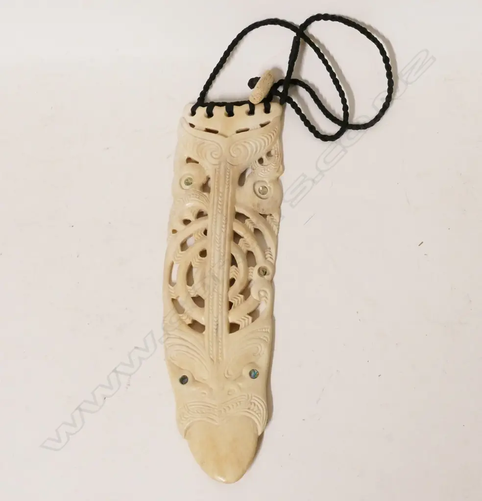 A contemporary Maori carved whale bone breast pendant Image 1++