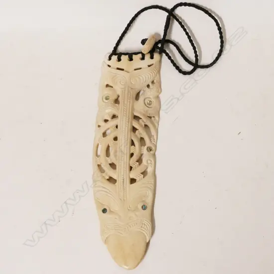 A contemporary Maori carved whale bone breast pendant