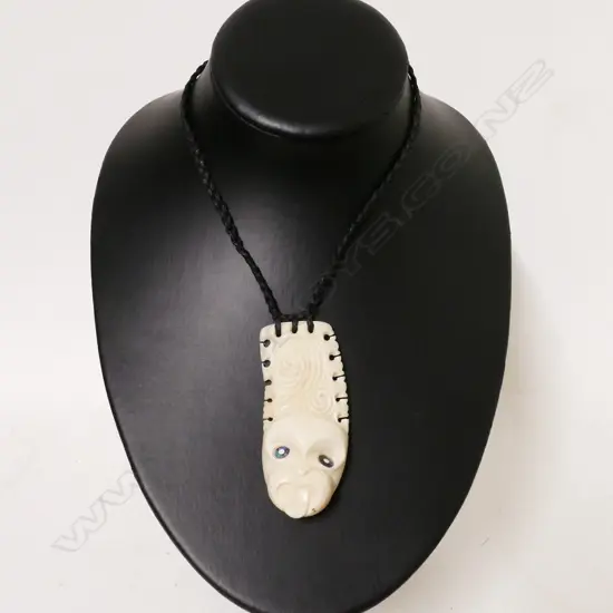 A Maori carved whale tooth pendant