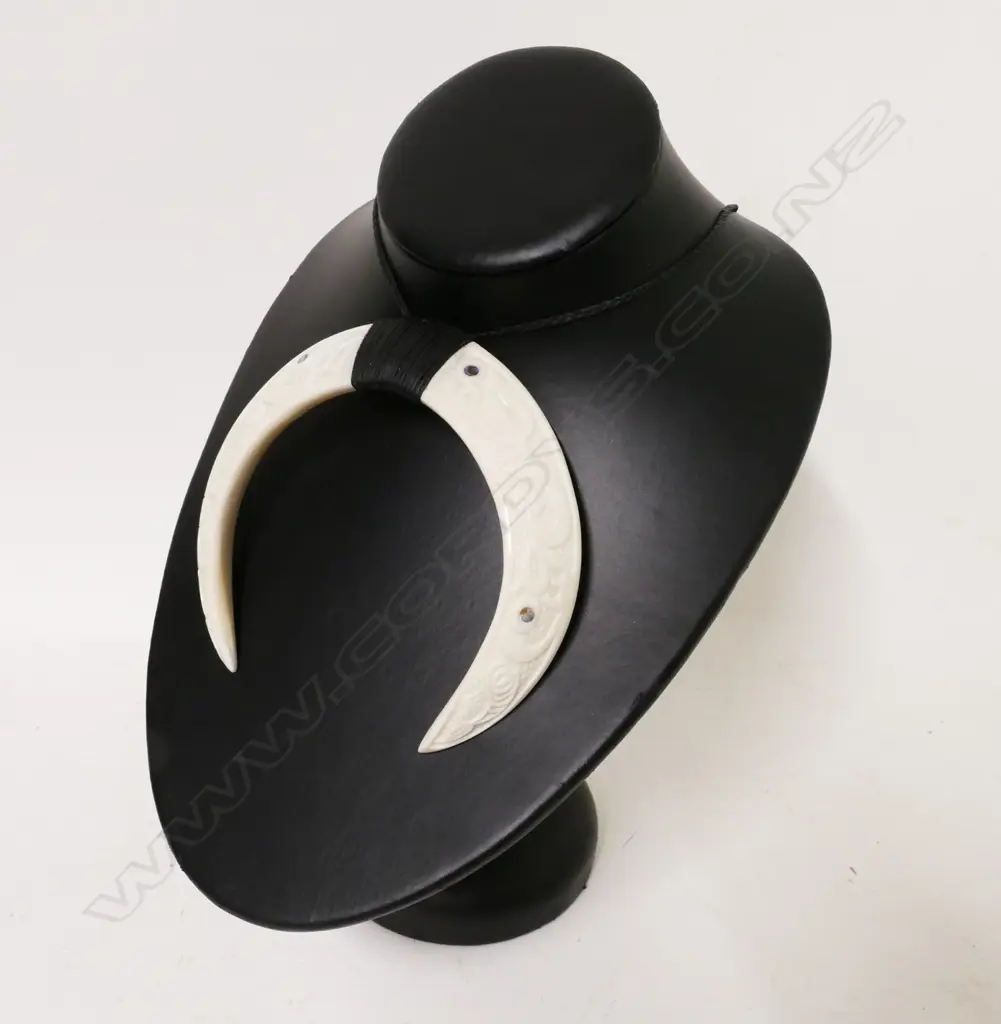 A Maori carved pig tusk breast pendant Image 1++