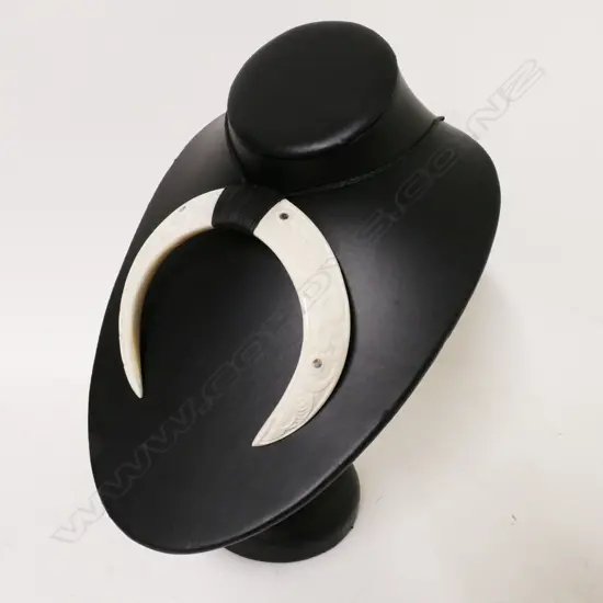 A Maori carved pig tusk breast pendant