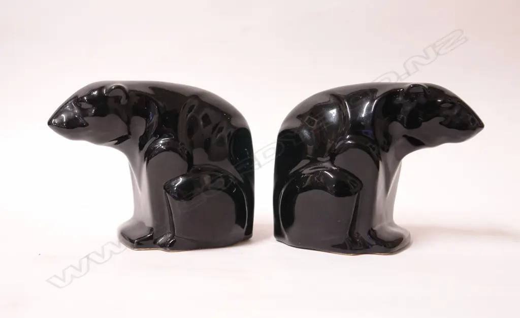 A pair of rare early Crown Lynn black glazed polar bear bookends Image 1++