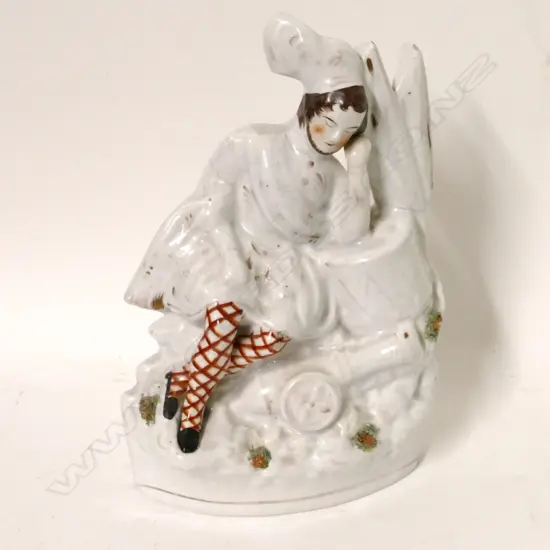 A Staffordshire figure of a resting Scottish soldier