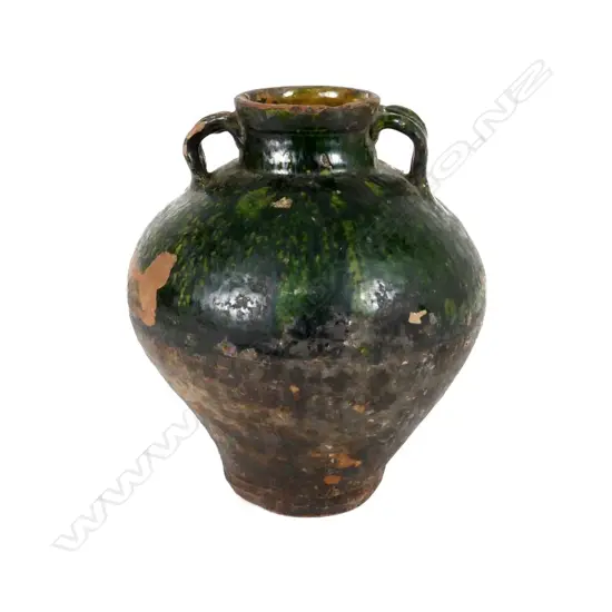 A European provincial two handled storage jar with emerald green glazed shoulder