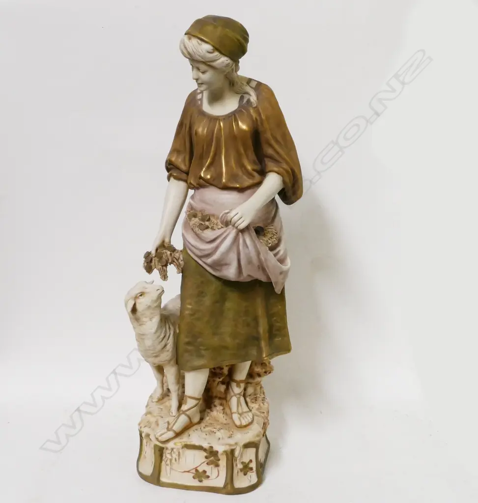 A Royal Dux bone china figure of a woman with sheep Image 1++