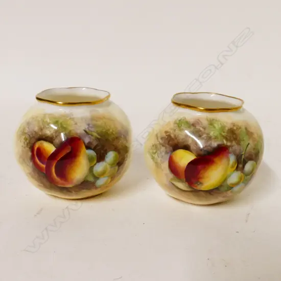 A pair of Royal Worcester small vases