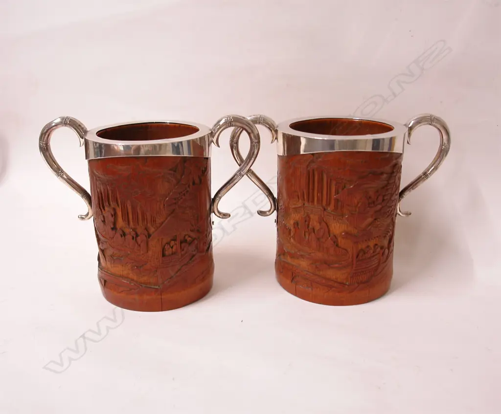 A pair of 19thC Chinese carved bamboo brush pots with English silver mounts Image 1++