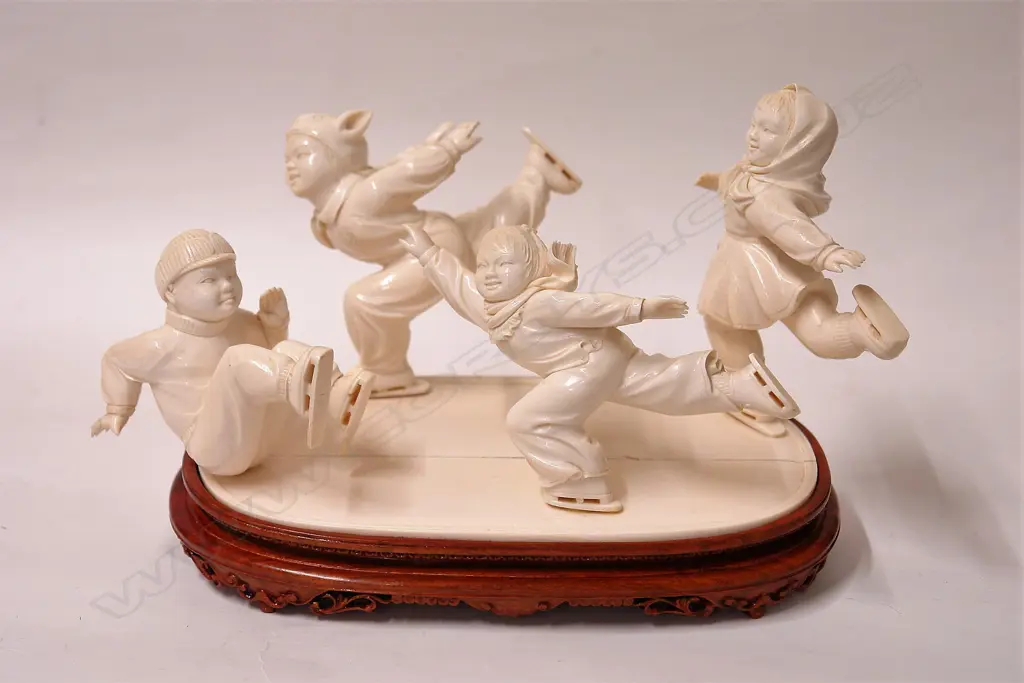 A quality large carved ivory figure group of four Chinese child skaters Image 1++