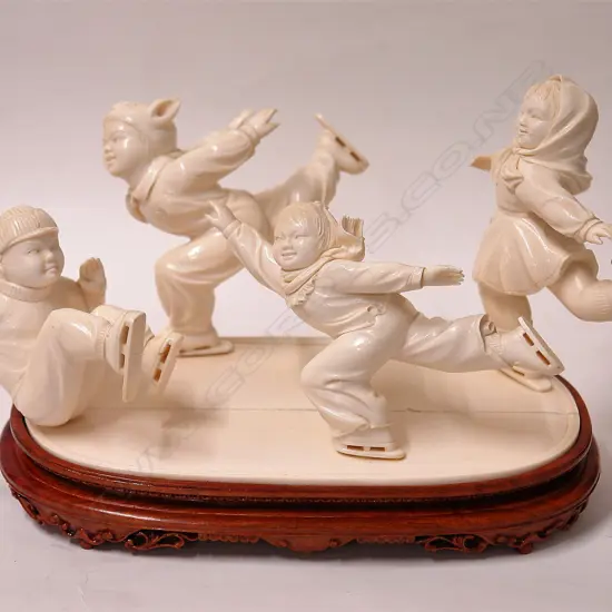 A quality large carved ivory figure group of four Chinese child skaters