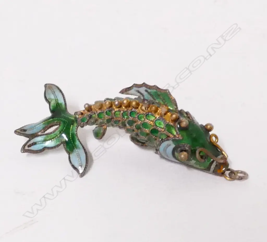 A Chinese gilt metal and enamel fish Image 1++