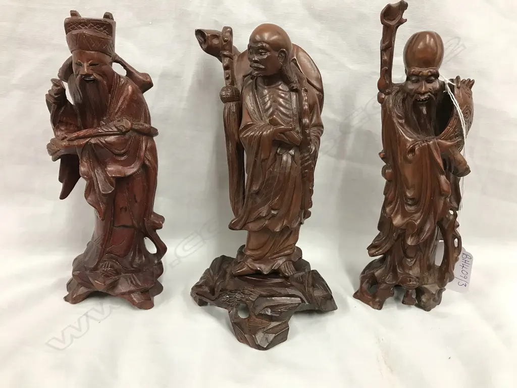 Three Chinese carved hardwood figures Image 1++