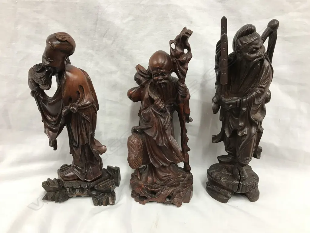 Three Chinese carved rosewood figures Image 1++