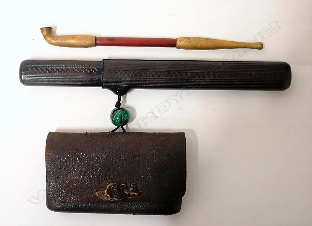 A Japanese smoker's pipe in case with pouch Image 1++