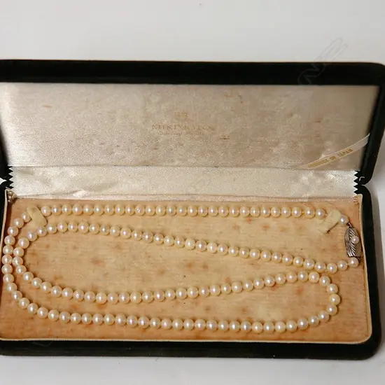 A vintage Mikimoto long strand of cultured pearls