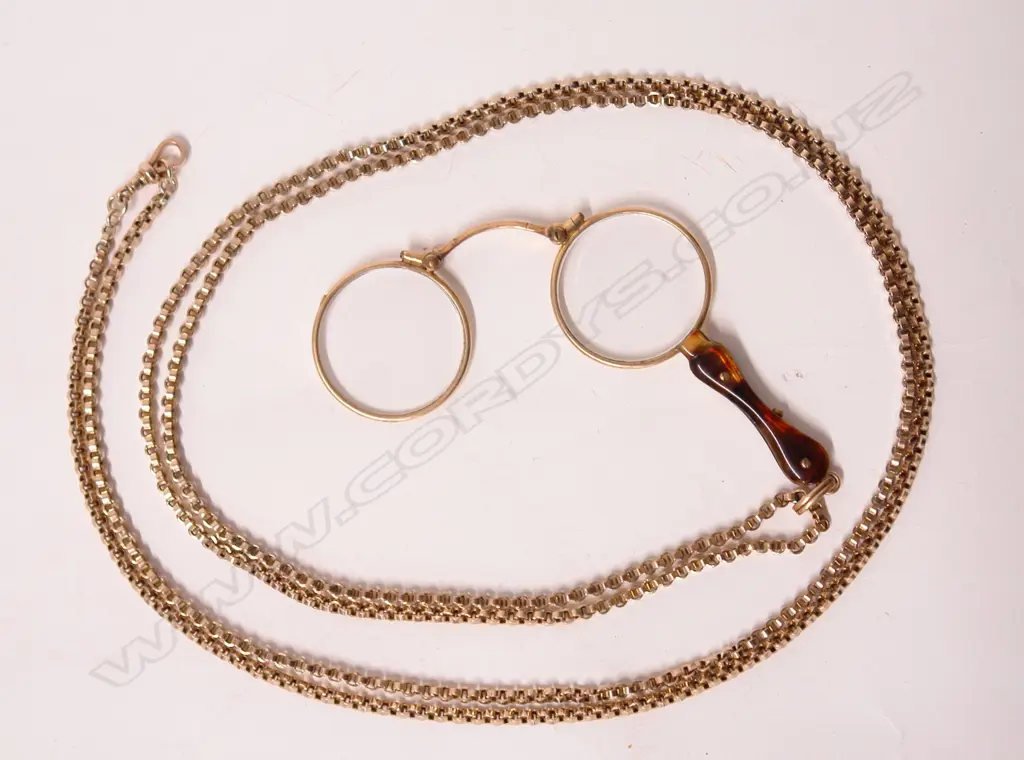 A c.1900 9ct. yellow gold muff chain with lorgnette Image 1++