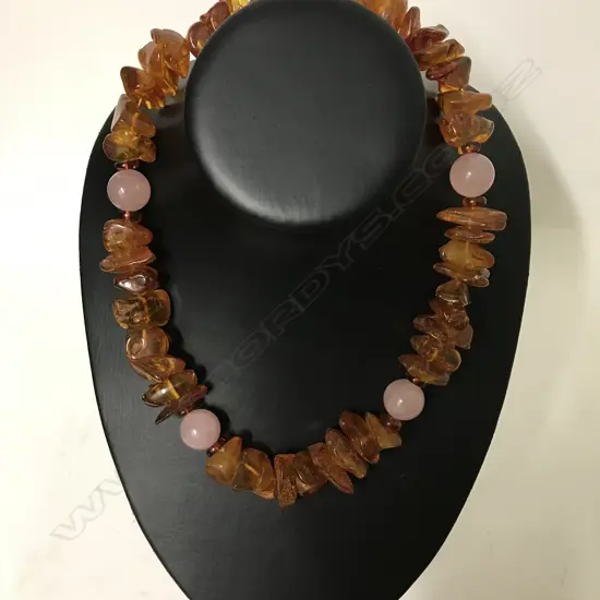 A vintage amber and rose quartz necklace