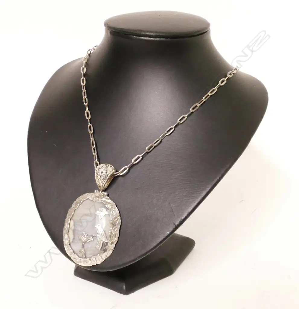 A silver and quartz pendant Image 1++