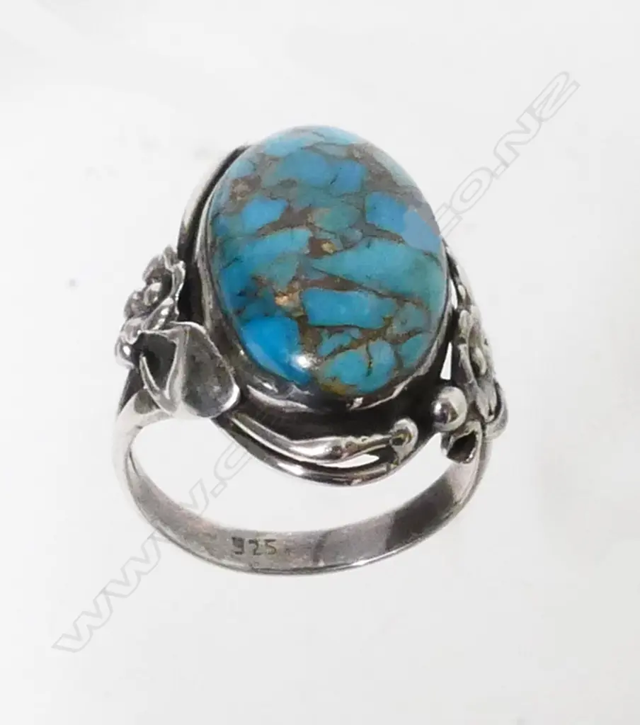 A Navajo silver and turquoise ring Image 1++