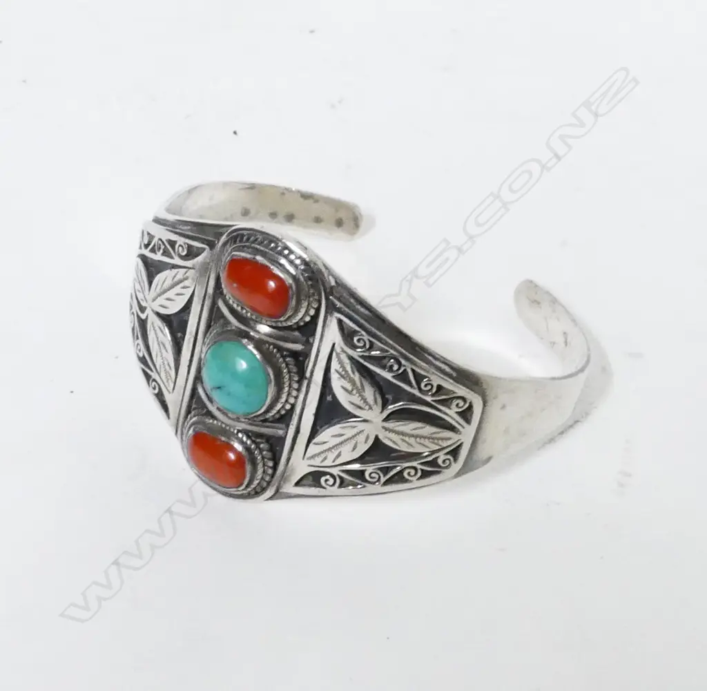 A Navajo silver coral and turquoise cuff Image 1++